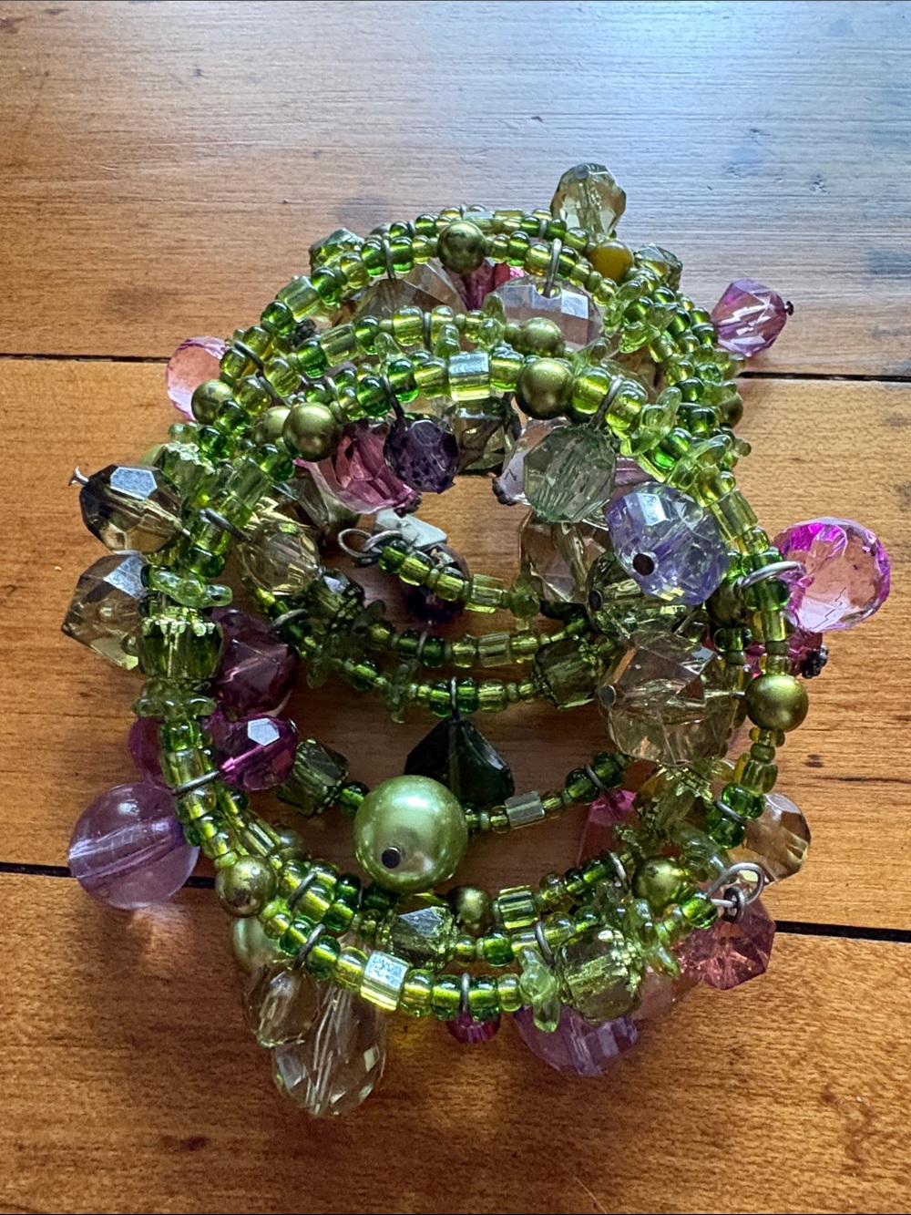 Green Beaded Coil Bracelet with Pink and Purple Accents